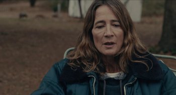 Movie still from “The Taking of Deborah Logan” (2014), directed by Adam Robitel – A person sitting in a chair; Close Up shot, Over the shoulder angle