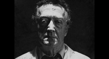 Movie still from “The Taking of Deborah Logan” (2014), directed by Adam Robitel – An older man with a mustache and a bow tie; Close Up shot, Low angle