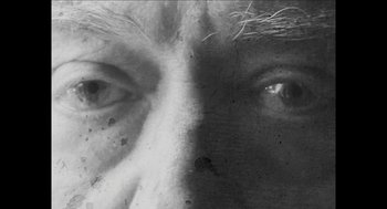 Movie still from “The Taking of Deborah Logan” (2014), directed by Adam Robitel – A black and white photo of a man's eyes; Extreme Close Up shot, High angle