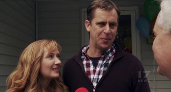 Movie still from “The Taking of Deborah Logan” (2014), directed by Adam Robitel – A man and a woman standing next to each other; Close Up shot, Over the shoulder angle