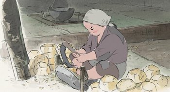 Movie still from “The Tale of The Princess Kaguya” (2013), directed by Isao Takahata – An illustration of an old woman using a hammer to cut wood; Medium shot, High angle