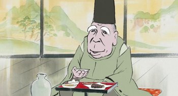 Movie still from “The Tale of The Princess Kaguya” (2013), directed by Isao Takahata – An old man sitting at a table with a plate of food; Close Up shot, Low angle