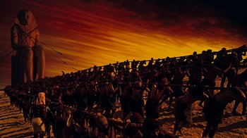 Movie still from “The Ten Commandments” (1956), directed by Cecil B. DeMille – A group of people standing on top of a field; Extreme Wide shot, Low angle