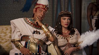 Movie still from “The Ten Commandments” (1956), directed by Cecil B. DeMille – A man and a woman dressed in ancient egyptian clothing; Medium shot, Over the shoulder angle