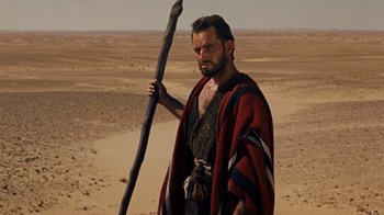 Movie still from “The Ten Commandments” (1956), directed by Cecil B. DeMille – A man with a spear in the middle of the desert; Medium shot, Low angle