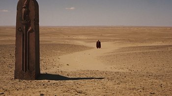 Movie still from “The Ten Commandments” (1956), directed by Cecil B. DeMille – A man walking in the middle of the desert; Extreme Wide shot, High angle