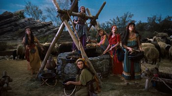Movie still from “The Ten Commandments” (1956), directed by Cecil B. DeMille – A group of women dressed in medieval clothing; Wide shot, High angle