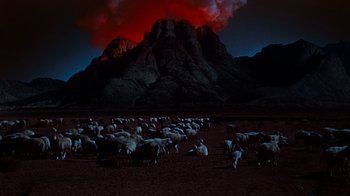 Movie still from “The Ten Commandments” (1956), directed by Cecil B. DeMille – A herd of sheep standing on top of a dirt field; Extreme Wide shot, High angle