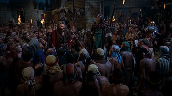 Movie still from “The Ten Commandments” (1956), directed by Cecil B. DeMille – A group of people gathered in a room; Wide shot, High angle