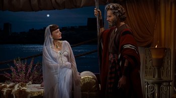Movie still from “The Ten Commandments” (1956), directed by Cecil B. DeMille – A man and a woman standing next to each other; Medium shot, Over the shoulder angle