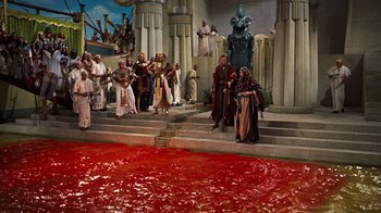 Movie still from “The Ten Commandments” (1956), directed by Cecil B. DeMille – A group of people standing in front of a pool of blood; Extreme Wide shot, High angle