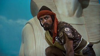 Movie still from “The Ten Commandments” (1956), directed by Cecil B. DeMille – A man dressed as an ancient greek soldier; Medium shot, Low angle