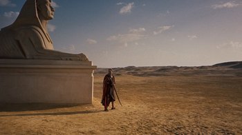 Movie still from “The Ten Commandments” (1956), directed by Cecil B. DeMille – A man in a costume is standing in the desert; Extreme Wide shot, Low angle