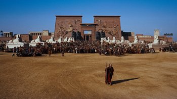 Movie still from “The Ten Commandments” (1956), directed by Cecil B. DeMille – A crowd of people standing in front of a building; Extreme Wide shot, High angle