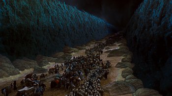 Movie still from “The Ten Commandments” (1956), directed by Cecil B. DeMille – A group of people are gathered in the middle of a cave; Extreme Wide shot, High angle