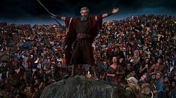 Movie still from “The Ten Commandments” (1956), directed by Cecil B. DeMille – An old man is standing on top of a hill; Extreme Wide shot, High angle