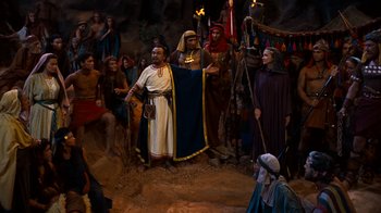 Movie still from “The Ten Commandments” (1956), directed by Cecil B. DeMille – A group of people dressed in ancient egyptian clothing; Wide shot, High angle