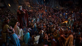 Movie still from “The Ten Commandments” (1956), directed by Cecil B. DeMille – A crowd of people sitting and standing in a room; Extreme Wide shot, High angle