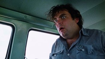 Movie still from “The Texas Chain Saw Massacre” (1974), directed by Tobe Hooper – A person driving a car; Close Up shot, Low angle