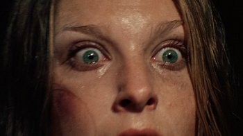 Movie still from “The Texas Chain Saw Massacre” (1974), directed by Tobe Hooper – A woman's eyes looking up at the sky; Extreme Close Up shot, Overhead angle