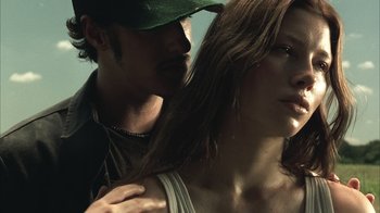 Movie still from “The Texas Chainsaw Massacre” (2003), directed by Marcus Nispel – A man and a woman standing next to each other; Close Up shot, Low angle