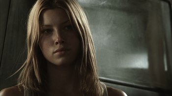 Movie still from “The Texas Chainsaw Massacre” (2003), directed by Marcus Nispel – A beautiful young woman with long blonde hair and green eyes; Close Up shot, Low angle