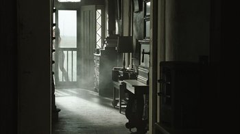Movie still from “The Texas Chainsaw Massacre” (2003), directed by Marcus Nispel – A room filled with lots of furniture in it; Wide shot, Low angle