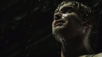 Movie still from “The Texas Chainsaw Massacre” (2003), directed by Marcus Nispel – A person with water on his face; Close Up shot, Low angle