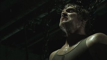 Movie still from “The Texas Chainsaw Massacre” (2003), directed by Marcus Nispel – A person with a wet face; Close Up shot, Low angle