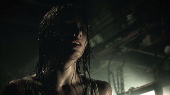 Movie still from “The Texas Chainsaw Massacre” (2003), directed by Marcus Nispel – A person with wet hair; Close Up shot, Low angle