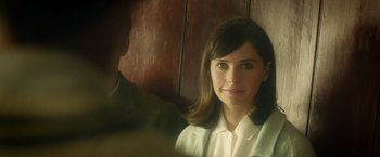 Movie still from “The Theory of Everything” (2014), directed by James Marsh – A woman in a white shirt and a man in a green jacket; Close Up shot, Over the shoulder angle
