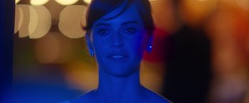 Movie still from “The Theory of Everything” (2014), directed by James Marsh – A woman's face in blue light; Close Up shot, Over the shoulder angle