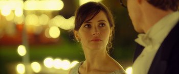Movie still from “The Theory of Everything” (2014), directed by James Marsh – A person looking at the camera; Close Up shot, Over the shoulder angle