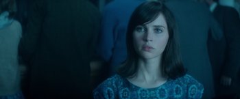 Movie still from “The Theory of Everything” (2014), directed by James Marsh – A person wearing a blue shirt; Close Up shot, Over the shoulder angle