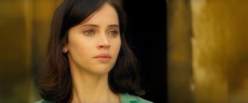 Movie still from “The Theory of Everything” (2014), directed by James Marsh – A person with long hair; Close Up shot, Over the shoulder angle