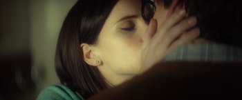 Movie still from “The Theory of Everything” (2014), directed by James Marsh – A woman's face with her eyes closed; Close Up shot, Over the shoulder angle
