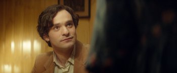 Movie still from “The Theory of Everything” (2014), directed by James Marsh – A person sitting in front of a mirror; Close Up shot, Over the shoulder angle