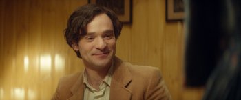 Movie still from “The Theory of Everything” (2014), directed by James Marsh – A person wearing a jacket; Close Up shot, Over the shoulder angle