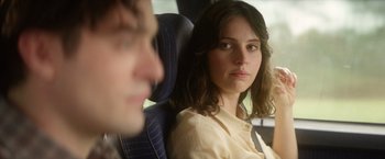 Movie still from “The Theory of Everything” (2014), directed by James Marsh – A woman sitting next to a man in a car; Close Up shot, Over the shoulder angle