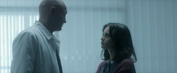 Movie still from “The Theory of Everything” (2014), directed by James Marsh – A man and a woman standing next to each other; Medium shot, Over the shoulder angle