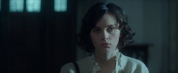 Movie still from “The Theory of Everything” (2014), directed by James Marsh – A person wearing a white shirt; Close Up shot, Over the shoulder angle