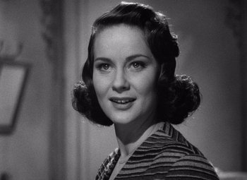 Movie still from “The Third Man” (1949), directed by Carol Reed – An old photo of an older woman with short dark hair; Close Up shot, Over the shoulder angle