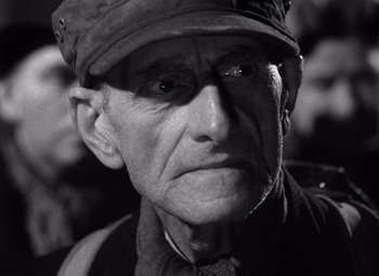 Movie still from “The Third Man” (1949), directed by Carol Reed – An older man wearing a hat and a jacket; Close Up shot, Low angle