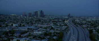 Movie still from “The Thirteenth Floor” (1999), directed by Josef Rusnak – An aerial view of a city at night with lights on; Extreme Wide shot, High angle