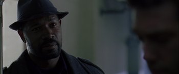 Movie still from “The Thirteenth Floor” (1999), directed by Josef Rusnak – A person wearing a hat; Close Up shot, Low angle