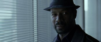 Movie still from “The Thirteenth Floor” (1999), directed by Josef Rusnak – A person wearing a hat; Close Up shot, Low angle