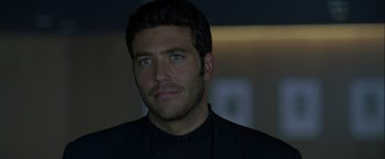 Movie still from “The Thirteenth Floor” (1999), directed by Josef Rusnak – A person wearing a suit; Close Up shot, Over the shoulder angle