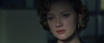 Movie still from “The Thirteenth Floor” (1999), directed by Josef Rusnak – A woman's face in the dark; Close Up shot, Over the shoulder angle