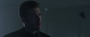 Movie still from “The Thirteenth Floor” (1999), directed by Josef Rusnak – A person looking at the camera; Close Up shot, Low angle