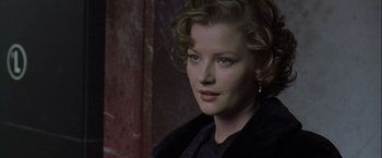 Movie still from “The Thirteenth Floor” (1999), directed by Josef Rusnak – A person wearing a suit and tie; Close Up shot, Over the shoulder angle